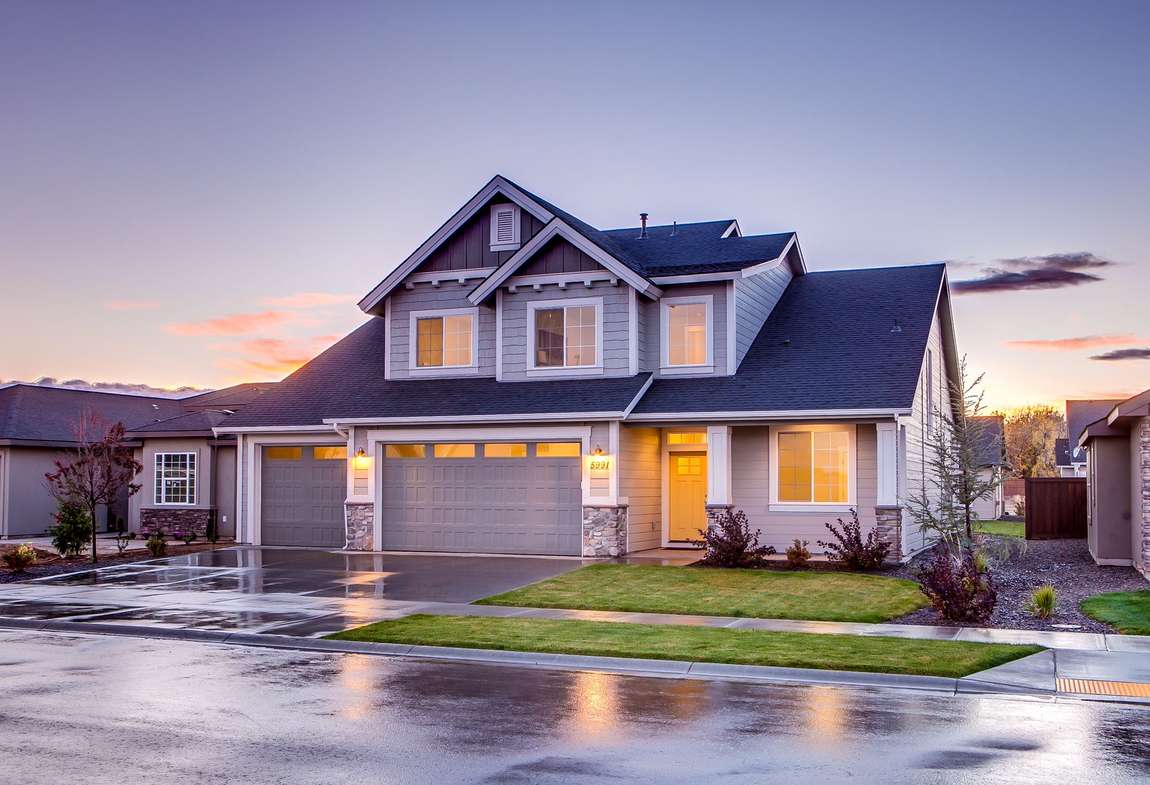 A house with its lights on at dusk